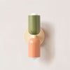 Playful and chic wall lamp in olive green and pink steel
