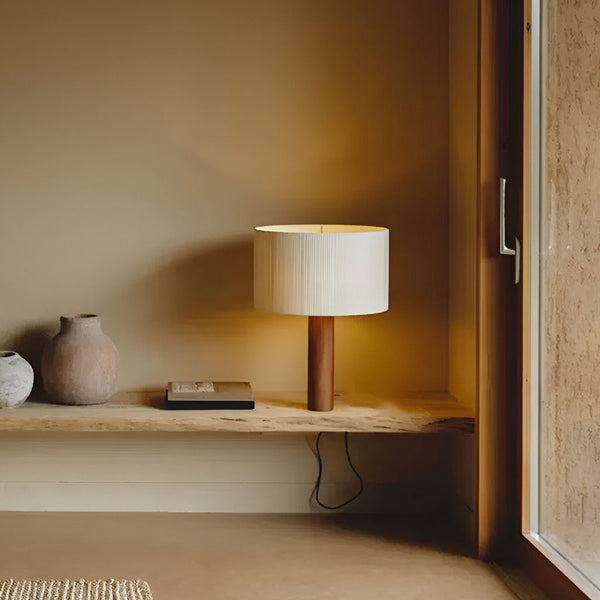 Elegant and contemporary table lamp with a cylindrical shade and wooden base