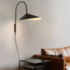 Modern and minimalist Willow Wall Lamp for living room - Steel surface in matte black finish.