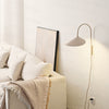Willow Wall Lamp in cozy living corner - Steel surface in matte cream finish.