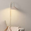 Willow Wall Lamp in cozy living area - Steel surface in matte cream finish.